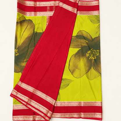 Yellow-green floral digital print Mysore crepe saree with red-and-gold Bentex border, displayed folded